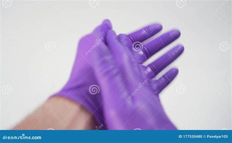hand treatment in protective gloves with an alcohol disinfectant stock footage video of