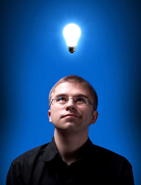 Man Looking Up With Idea Light Bulb Above Head Pictures Images And