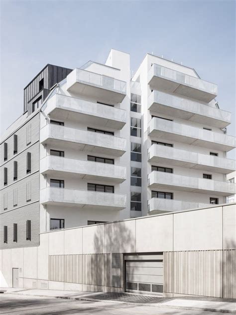 This Facade Of This Apartment Block Features A Series Of Balconies