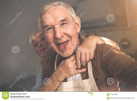Cheerful Old Married Couple Having Fun In Cook Room Stock Image Image