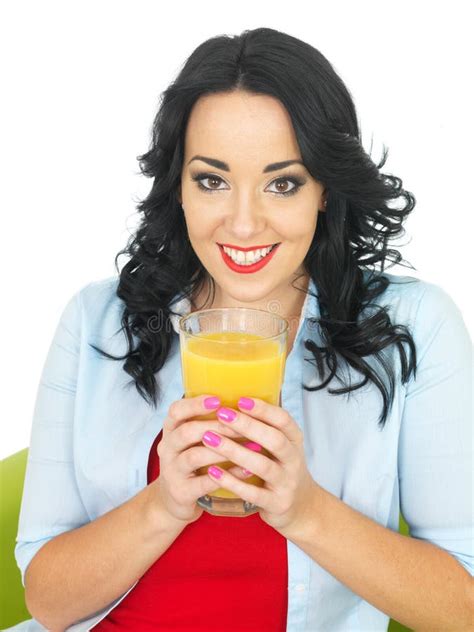 Healthy Young Woman Drinking Large Glass Of Fresh Orange Juice Stock