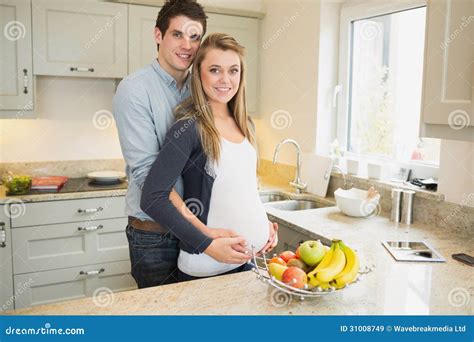 Man With Pregnant Wife In The Kitchen Stock Image Image Of Affection