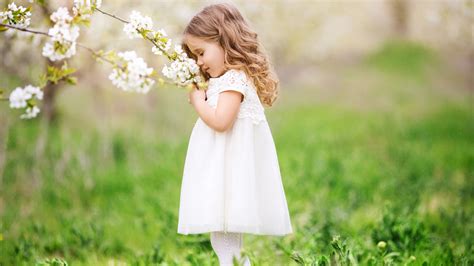1920x1080 Little Cute Girl Smelling Flowers Laptop Full Hd 1080p Hd 4k Wallpapers Images