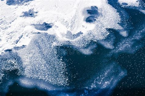 Frozen Blue Water And Wave Covered With Ice And Snow Abstract Wi Stock