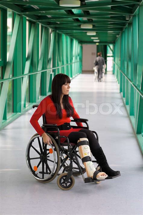 Young Woman With A Leg Cast And Wheelchair In The Hospital Stock