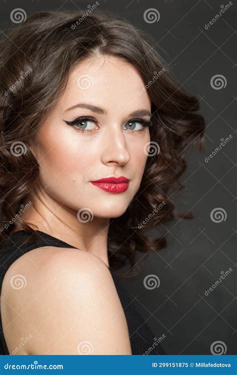 Perfect Woman Brunette With Makeup And Shiny Wavy Brown Hair Studio