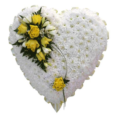 Item pictured is a depiction of an arrangement that we will make as similar as possible with the same. Funeral Flowers Lemon Funeral Heart Tribute
