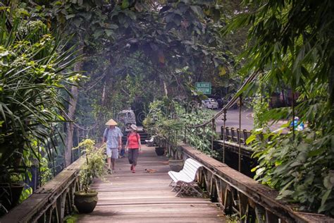 A Couple Walks Over A Wooden Bridge In Ubud Bali Editorial Photography Image Of Male Adult