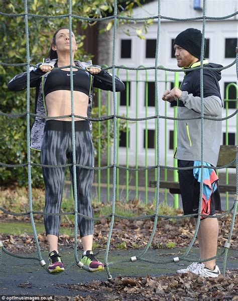 Kym Marsh Flashes Her Abs As She Completes Set Of Pull Ups In The Park