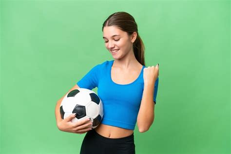 Premium Photo Teenager Caucasian Girl Playing Football Over Isolated Background Celebrating A