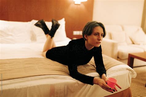 Portrait Of Young Androgyne Woman On The Bed By Stocksy Contributor