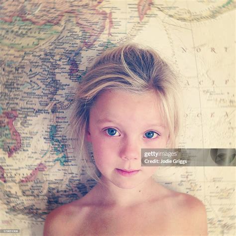 Portrait Of Child Standing In Front Of World Map High Res Stock Photo