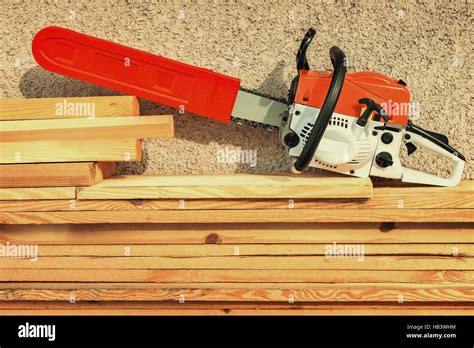 Chainsaw And Lumber Stock Photo Alamy