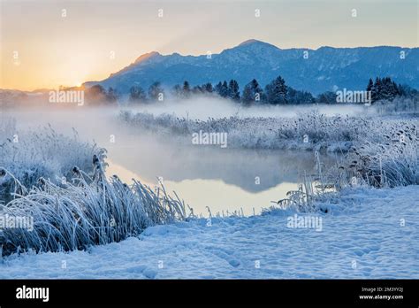 Snowy Winter Landscape With The Uffinger Ach At Sunrise With