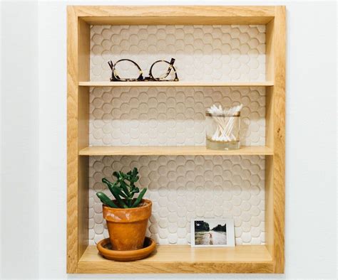 Instead of sticking out of the wall, a recessed cabinet is poked in. Building Recessed Bathroom Wall Shelves | Bathroom wall ...