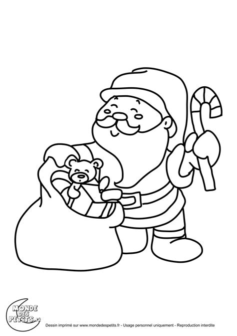 Père noel sur son traineau et tracter par ses rennes dans le ciel. Monde des petits - Coloriages à imprimer