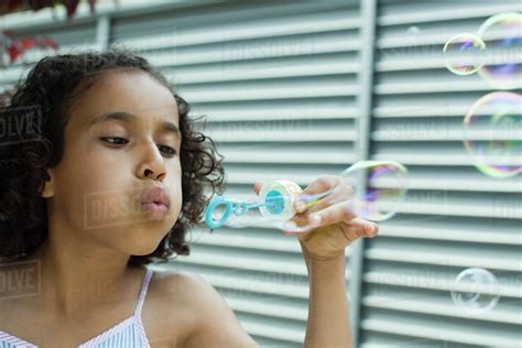 Girl Blowing Bubbles Stock Photo Dissolve