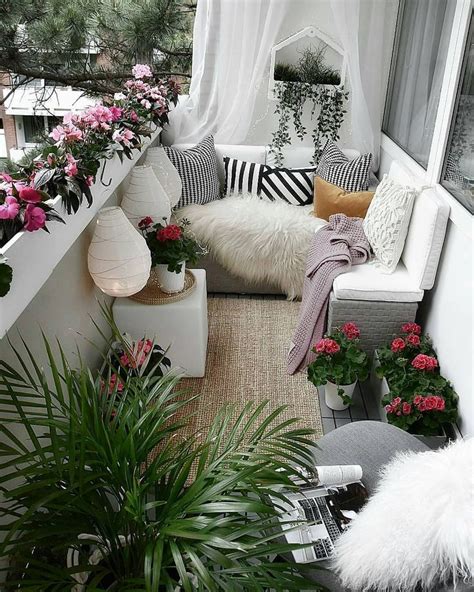 A Balcony With Lots Of Potted Plants And Flowers On The Windowsill