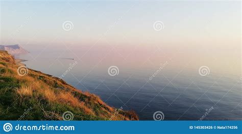 Seascape Gorgeous Pink And Lilac Sunset Over The Quiet Expanse Of The