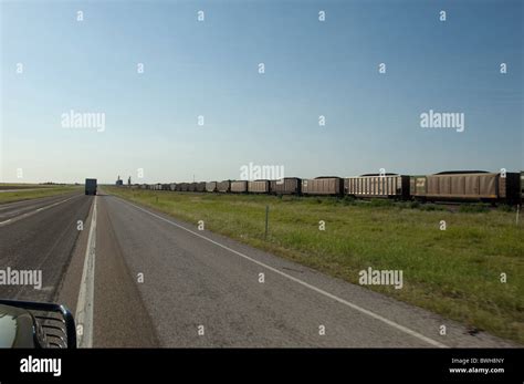 Freight Train Rolls Along Tracks In Rural Area Along Us Highway 287 In