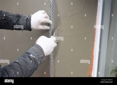 Contractor Plastering Wall With Putty Knife Fiberglass Mesh Plaster