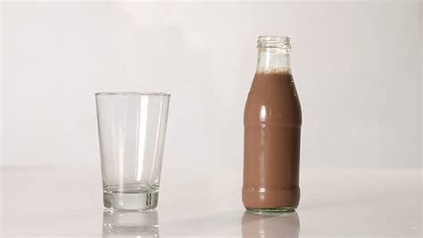 Bottle Pouring Milk Chocolate Into A Glass Stock Footage Video 6505229