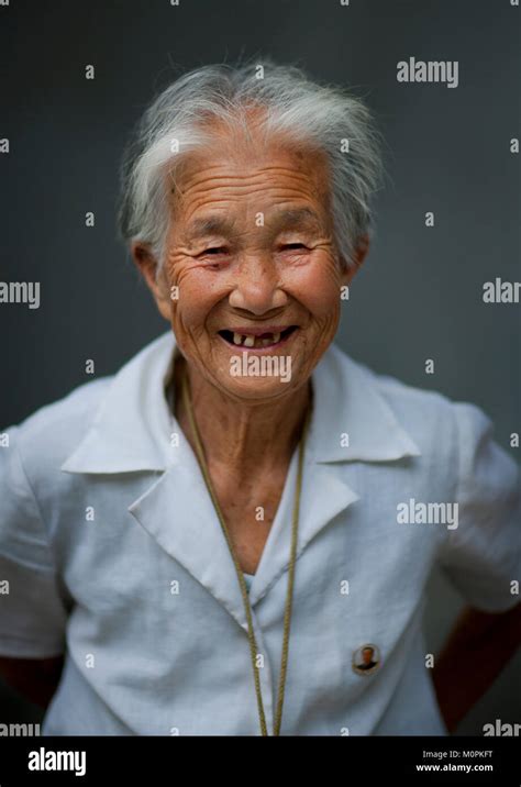 North Korean Elderly Woman Smiling With Toothless Grin Pyongan