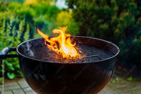 Black Barbecue With Burning Coals Outside Stock Photo Adobe Stock
