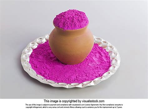 Pot Filled With Pink Gulal Color Powder In Plate For Holi Festival