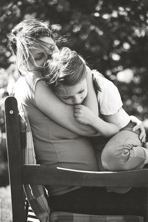 Mother Cuddling And Hugging Her Daughter Black And White Shot By