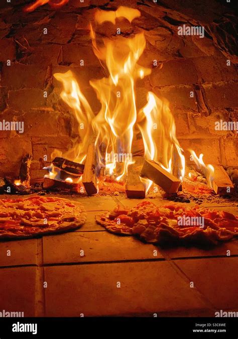Cooking In Pizza Oven Stock Photo Alamy