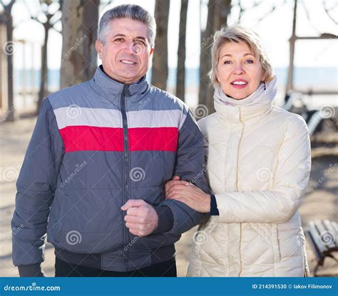 Smiling Mature Married Couple Walk In Park Stock Photo Image Of