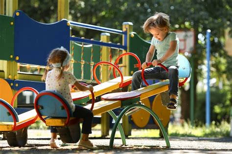 Kids Playing In Park Together Free Photo