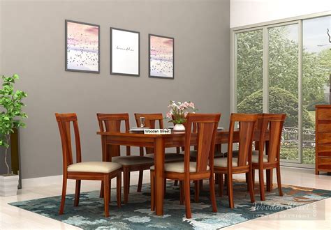 In a limited space, round dining tables can accommodate more people. Buy Mcbeth Storage 8 Seater Dining Set Online in India ...