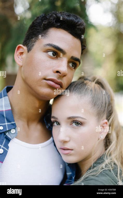 Portrait Of Young Couple Hugging Stock Photo Alamy