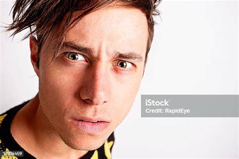 Serious Worriedlooking Young Man Stares Intently Stock Photo Download
