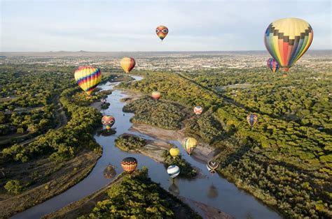 Hot Air Balloons Drift Over The Rio Grande River In Albuquerque New