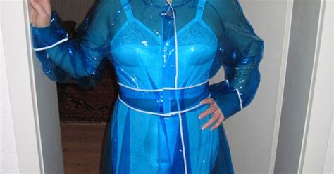 gaby from duesseldorf is wearing a pvc retro style raincoat clear blue with vintage lingerie
