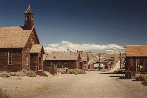 Very Old Colored Vintage Photo With Abandoned Western Saloon Building