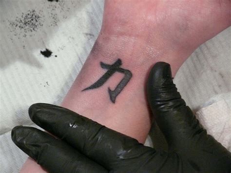 Road strength nobleness symbols tattoo design. 30 Stunning Strength Tattoos Designs - EchoMon