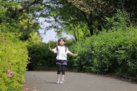 Japanese Girl Playing With Jump Rope Stock Photo Image Of Playfield Ground