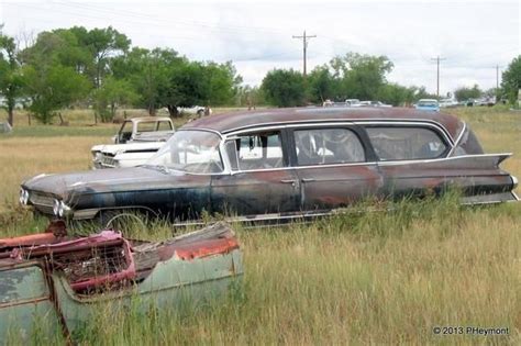 A Field of (Rusted) Dreams | Hearse, Cadillac, Exotic sports cars