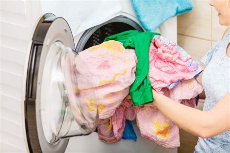Person Putting Clothes Into Washing Machine Stock Image Image Of
