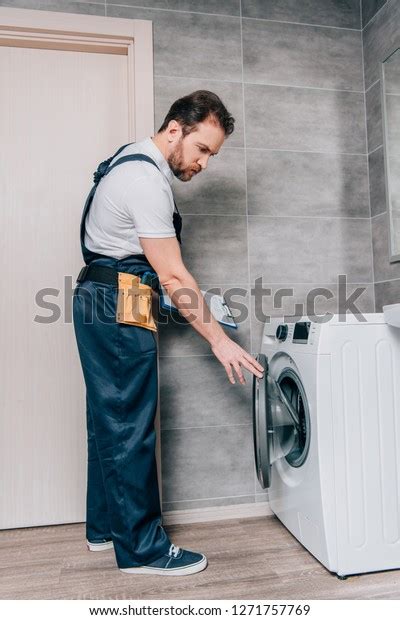 Male Adult Repairman Toolbelt Clipboard Checking Stock Photo 1271757769