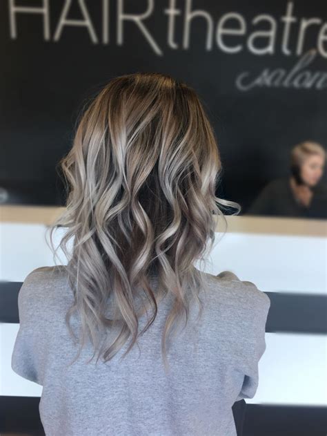 Blonde hair with lowlights underneath. Icy cool platinum silver blonde with dark brown lowlights ...