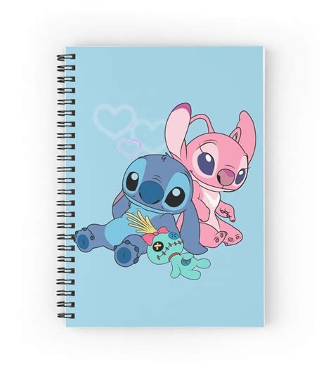 A Spiral Notebook With An Image Of Two Stitchy Characters On It One Is Pink And The Other Is Blue