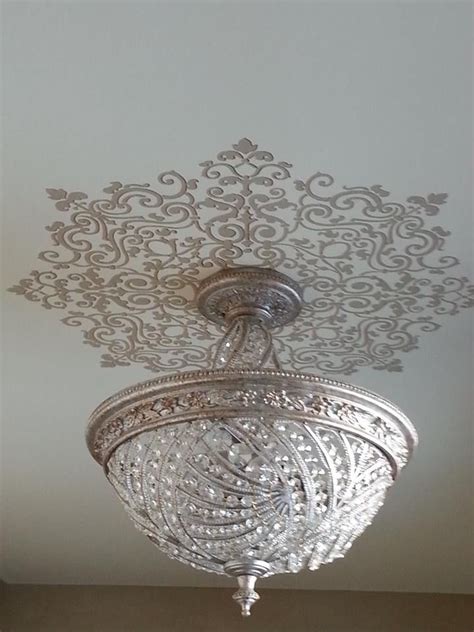 Completely change the appearance of a drab or older style ceiling with a decorative pvc ceiling medallion. Grand Ceiling Medallion Stencils around light fixture ...