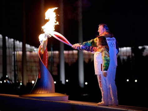 Sochi Winter Olympics Launch With Space Flown Torch Cosmonaut Flag
