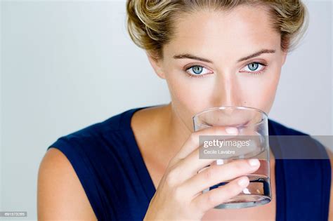Woman Drinking A Glass Of Water High Res Stock Photo Getty Images