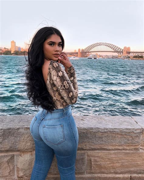 image may contain one or more people people standing ocean sky outdoor and water jeans ass